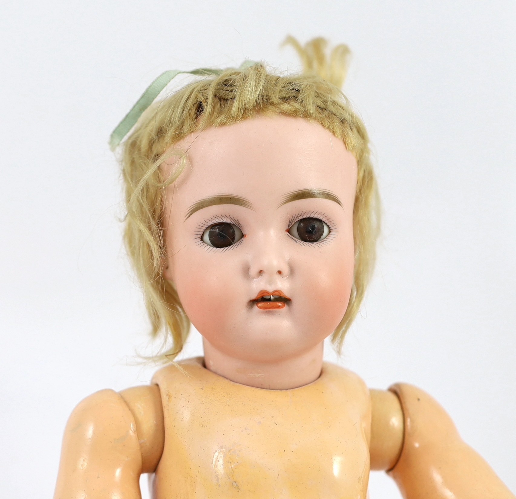 A J.D. Kestner bisque doll, German, circa 1910, 18in.